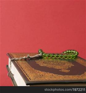 OLYMPUS DIGITAL CAMERA. High resolution photo. green prayer beads quran. High quality photo