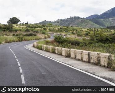 OLYMPUS DIGITAL CAMERA. highway roads with natural landscape