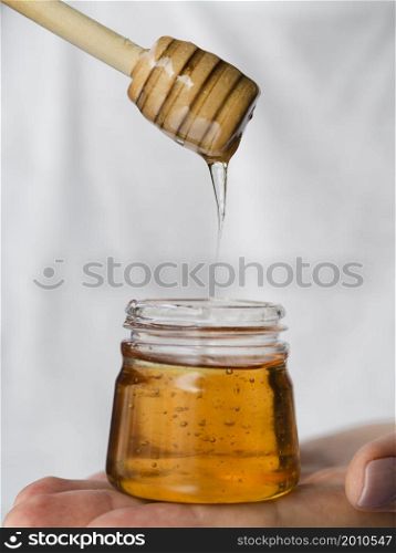 OLYMPUS DIGITAL CAMERA. honey dripping from dipper