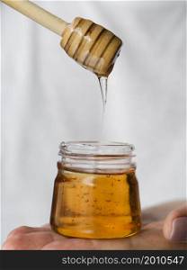 OLYMPUS DIGITAL CAMERA. honey dripping from dipper