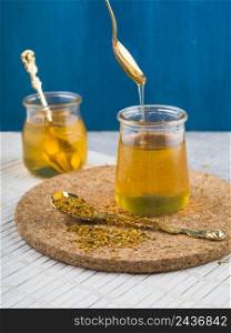 OLYMPUS DIGITAL CAMERA. honey pot with bee pollens spoon cork coaster