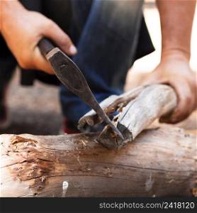 OLYMPUS DIGITAL CAMERA. man cutting wood with axe