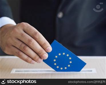 OLYMPUS DIGITAL CAMERA. man putting european election ballot box