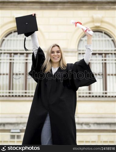 OLYMPUS DIGITAL CAMERA. smiley young woman celebrating her graduation