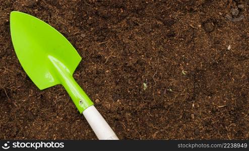 OLYMPUS DIGITAL CAMERA. top view shovel soil