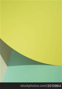 OLYMPUS DIGITAL CAMERA. yellow abstract paper shapes with shadow