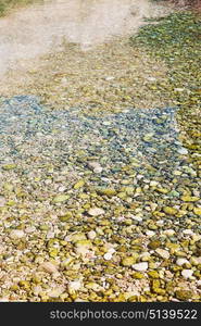 oman old river and stone flowing water near the sea