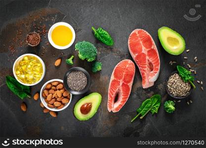 Omega-3 fats. Salmon fish and vegetarian sources of unsaturated fatty acids. Healthy food concept for good health. Top view