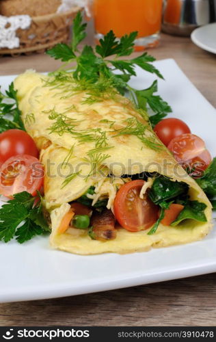 Omelet stuffed vegetables with herbs and tomatoes