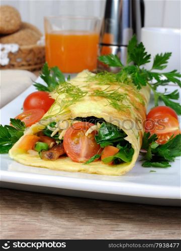 Omelet stuffed vegetables with herbs and tomatoes