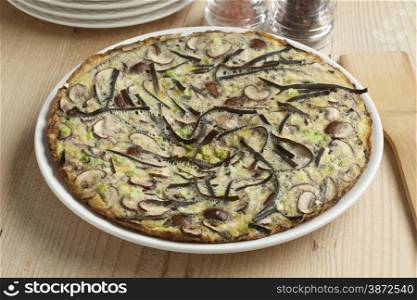 Omelet with sea spaghetti, mushrooms and spring onions