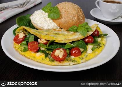 Omelet with spinach, basil, dill, cherry tomatoes and cheese Adyg