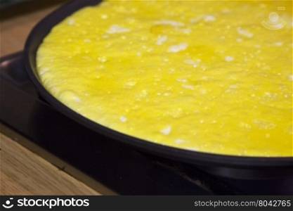Omelette in pan, close up, horizontal image