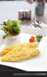 omelette on wood background