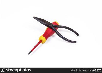 On a light background lie a screwdriver and pliers