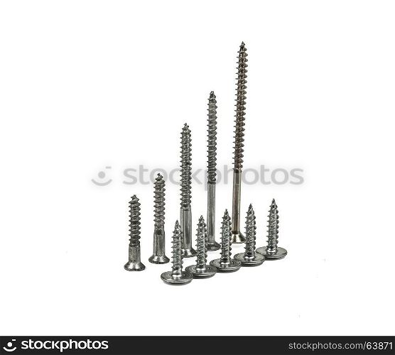 On a light background stand on the screws of screws of different sizes