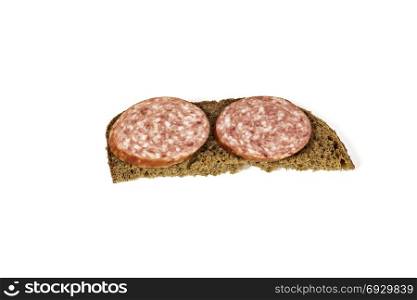 On a white background a sandwich with black bread and sausage