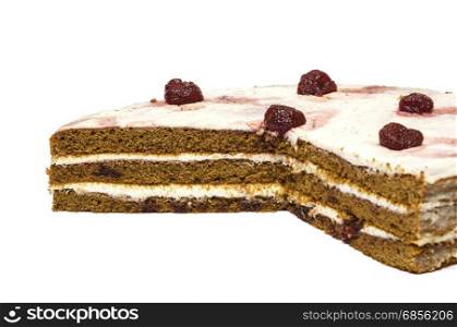 On a white background sliced chocolate cake of sponge cakes with strawberries