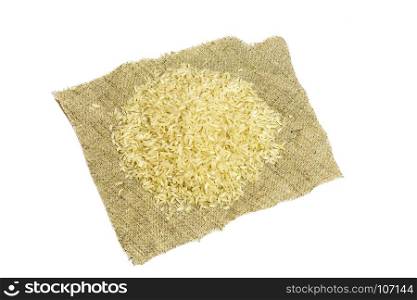 On a white background there is a napkin with a handful of rice croup