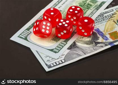 On banknotes are five red poker dice