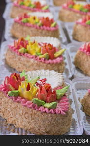 On cakes production. cakes production on factory: closeup photo of prepared cakes