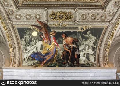 On ceiling painting angel with wings shows a farmer the sun