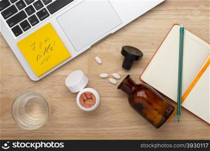 On-line treatment anti stress concept with bottles of medicine pills on the table. On-line treatment concept with bottles of medicine pills on the wooden table