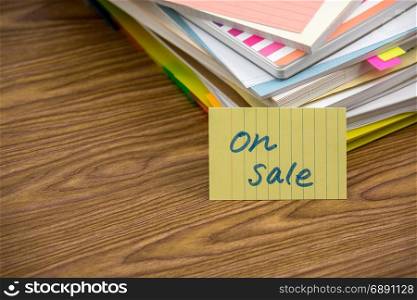 On Sale; The Pile of Business Documents on the Desk