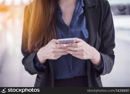 on smartphone. Smiling face of asian woman holding cellphone with E-commerce Shopping online website Reading Online Article, Blog and vlog.