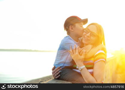 on sunrise. woman with her son on sunrise