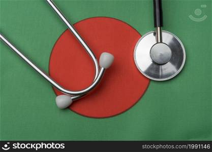 On the flag of Bangladesh is a stethoscope. The concept of medicine.. On the flag of Bangladesh is a stethoscope.