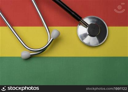 On the flag of Bolivia is a stethoscope. The concept of medicine.. On the flag of Bolivia is a stethoscope.