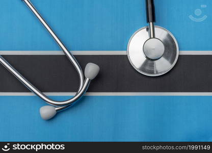 On the flag of Botswana is a stethoscope. The concept of medicine.. On the flag of Botswana is a stethoscope.