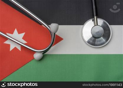 On the flag of Jordan is a stethoscope. The concept of medicine.. On the flag of Jordan is a stethoscope.