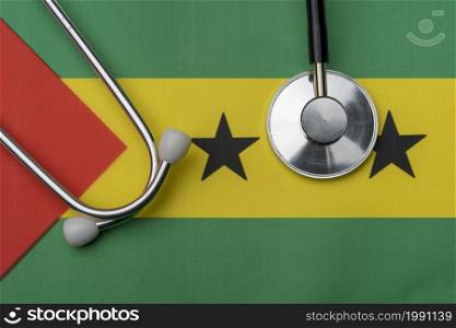 On the flag of Sao Tome and Principe is a stethoscope. The concept of medicine.. On the flag of Sao Tome and Principe is a stethoscope.