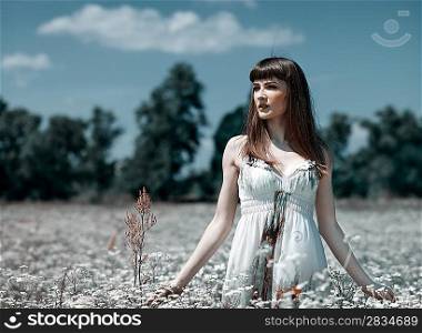 On the meadow, abstract natural backgrounds with beauty young woman