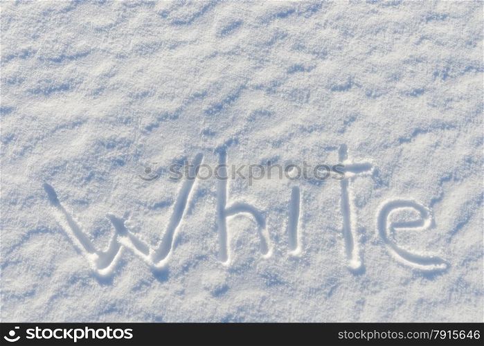 on the snow surface is written the word white