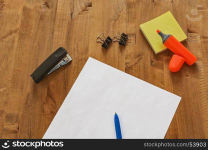 On the table are different office supplies