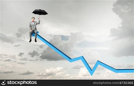 On top of success. Young businessman with umbrella sitting on increasing arrow
