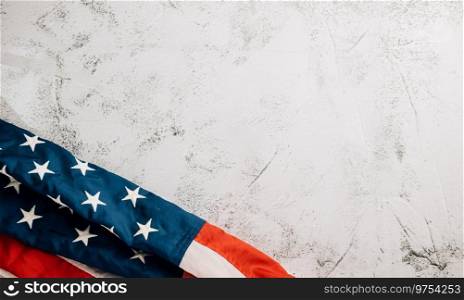 On Veteran’s Day, a vintage American flag waves proudly, symbolizing honor, unity, and pride. Stars, stripes, and government convey patriotic glory. isolated on cement background