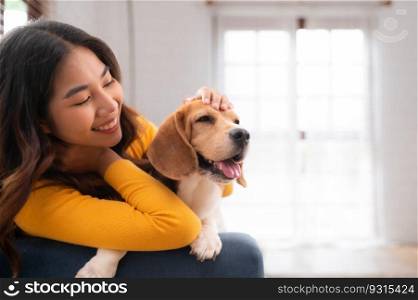 On weekends, a beagle and her owner sit in their living room,