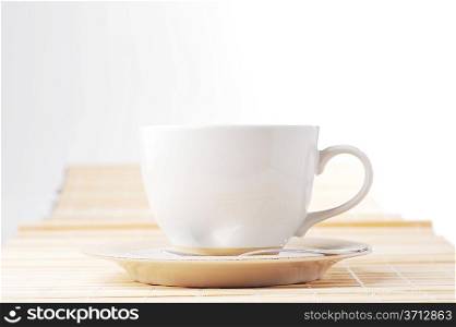 On wooden napkin cup with tea