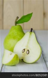 One and a half green pears . One and a half green pears over white background