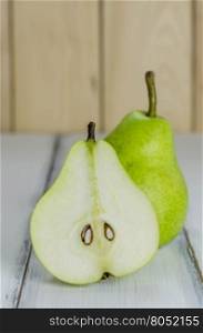 One and a half green pears . One and a half green pears over white background