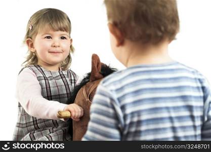 One and a half year old children: a boy and a girl are playing together.