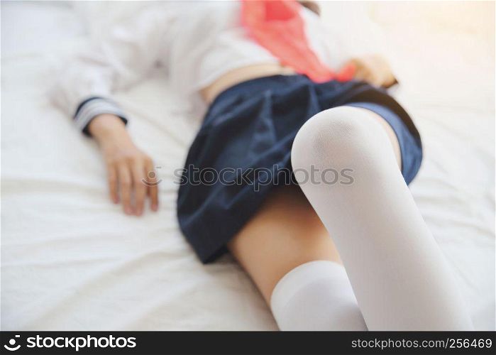 one asian school girl leg in white tone