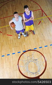 one basket ball game player standing in sport gym with ball