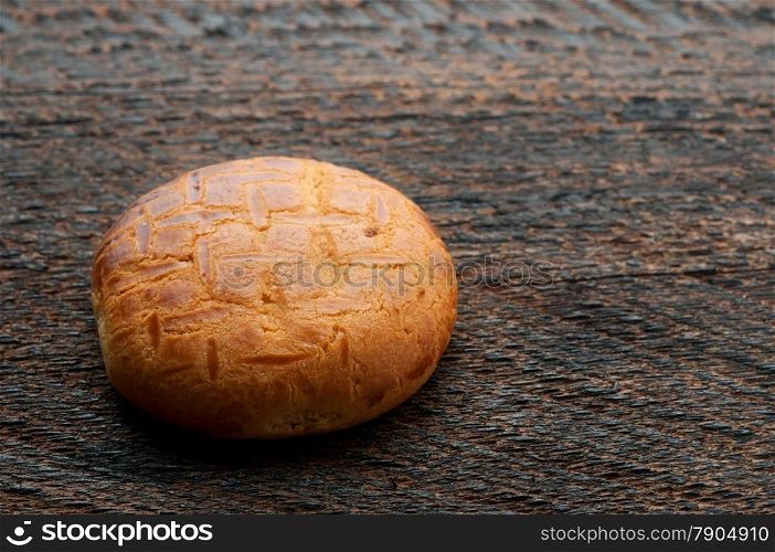 One Biscuit Cookies On Wooden Background