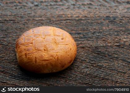 One Biscuit Cookies On Wooden Background
