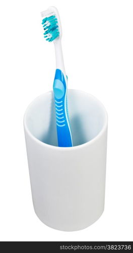 one blue tooth brush in ceramic glass isolated on white background